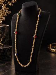 Gold-tone multicolor glass station necklace displayed on a black necklace bust