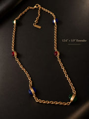 Full view of the necklace with red, blue and green glass accents and an extension chain