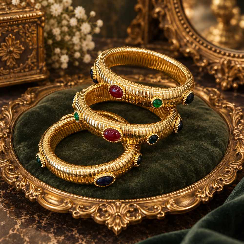 Multicolor glass ribbed stretch bangles displayed together on a tray; sold individually