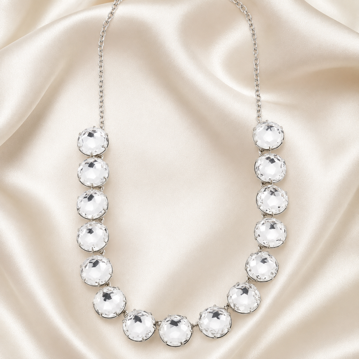 Silver-tone statement necklace with oversized clear faceted crystal-style accents