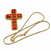 Red cross pendant with gold-tone twisted edging and a gold-tone rope-style necklace chain on a white background