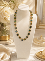 Watermelon AB cube statement necklace on a cream display bust