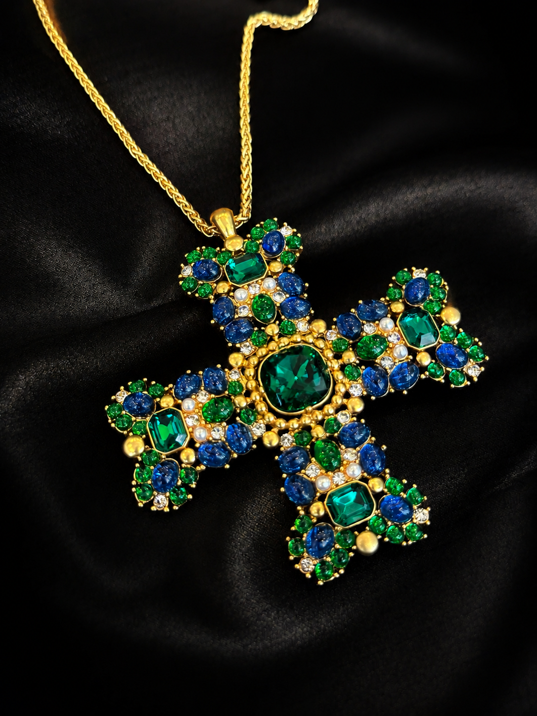 Front detail of green and blue glass cross brooch pendant necklace