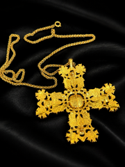 Back view showing brooch pin and pendant fitting on gold-tone cross necklace
