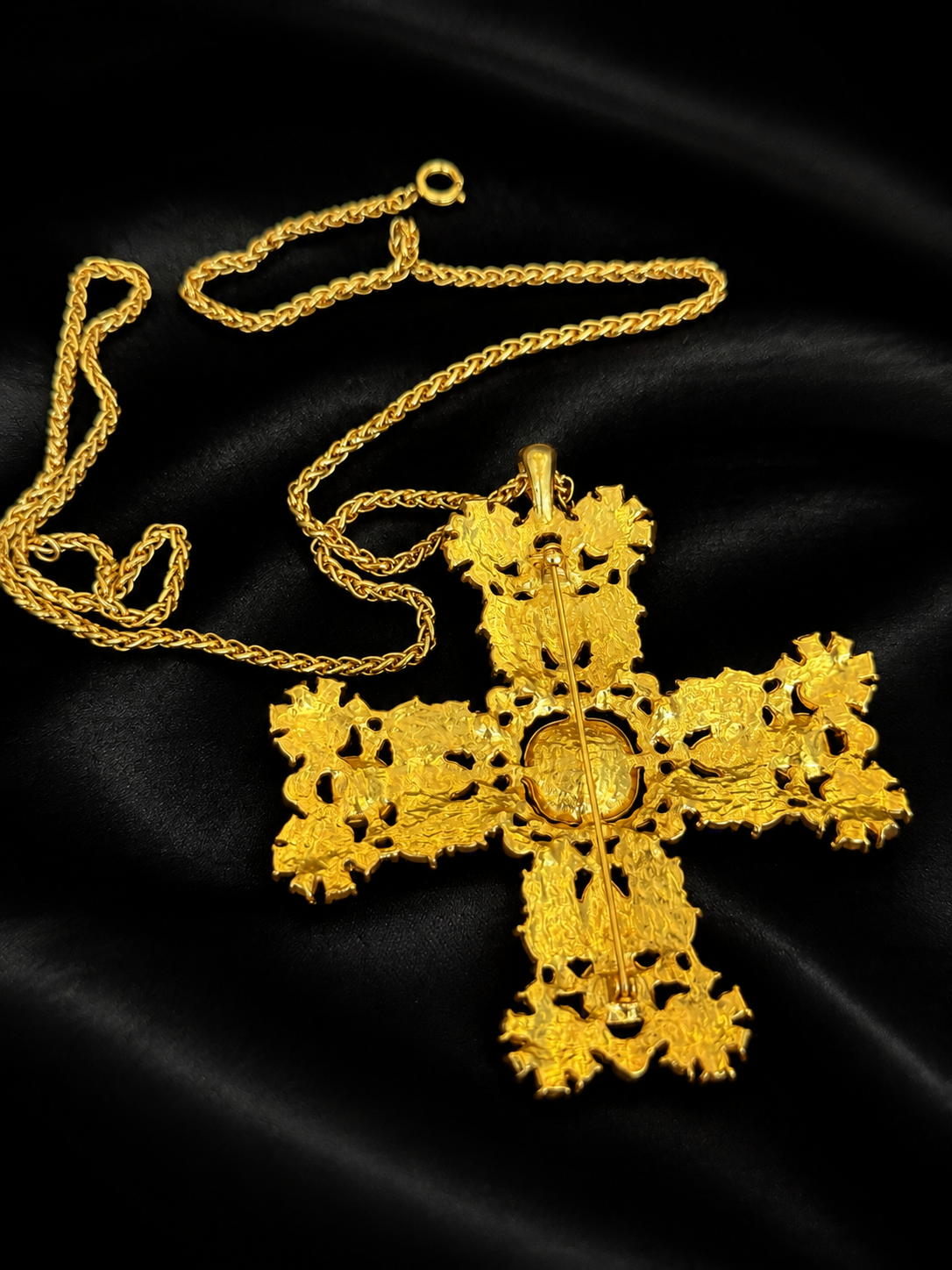 Back view showing brooch pin and pendant fitting on gold-tone cross necklace