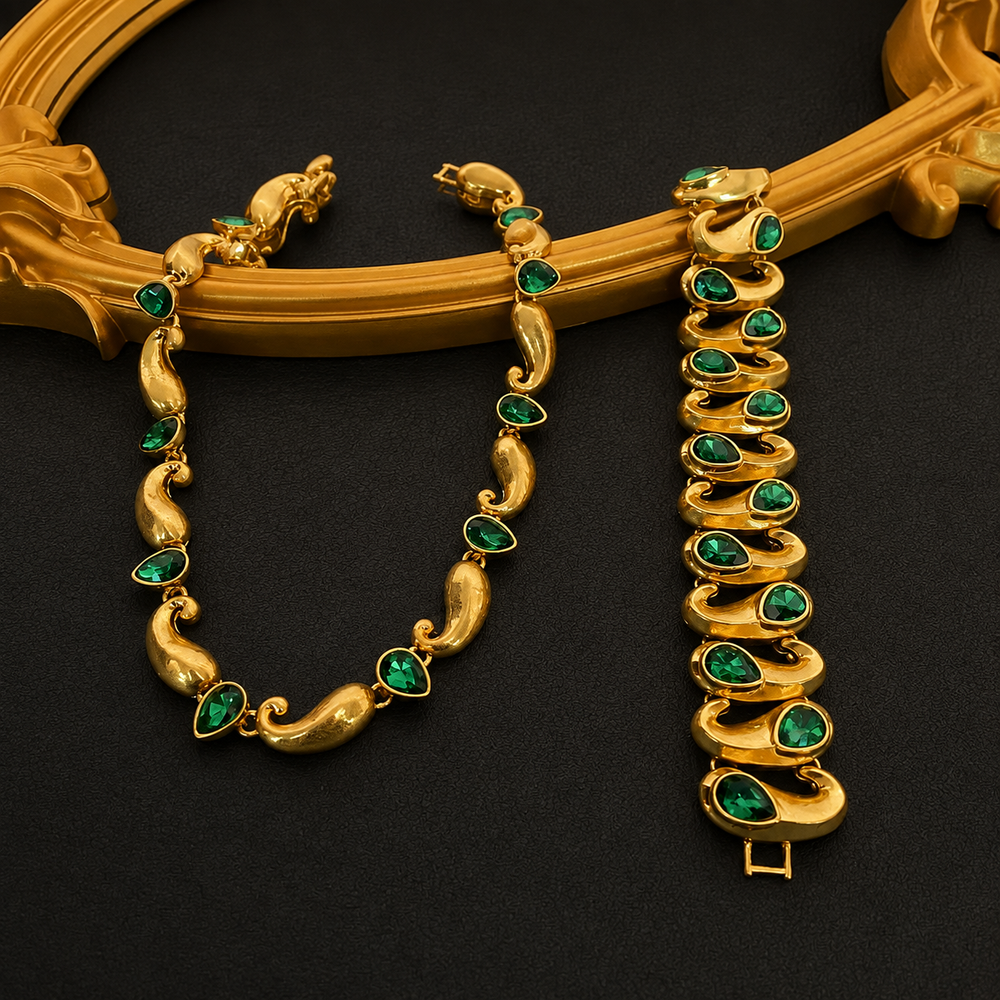 Gold-tone necklace and bracelet set with green faceted teardrop-shaped accents