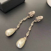 Back view showing the clip-on closures and linked marquise-shaped settings