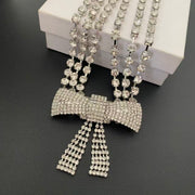 Close-up of the sparkling bow centrepiece and two dangling tails