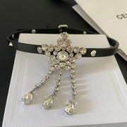 Black studded choker with a clear faceted star centrepiece and three teardrop tassels