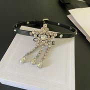 Angled view of the sparkling star choker with its black band and adjustable buckle