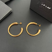 Front view of gold-plated brass hoop earrings with post-back closures
