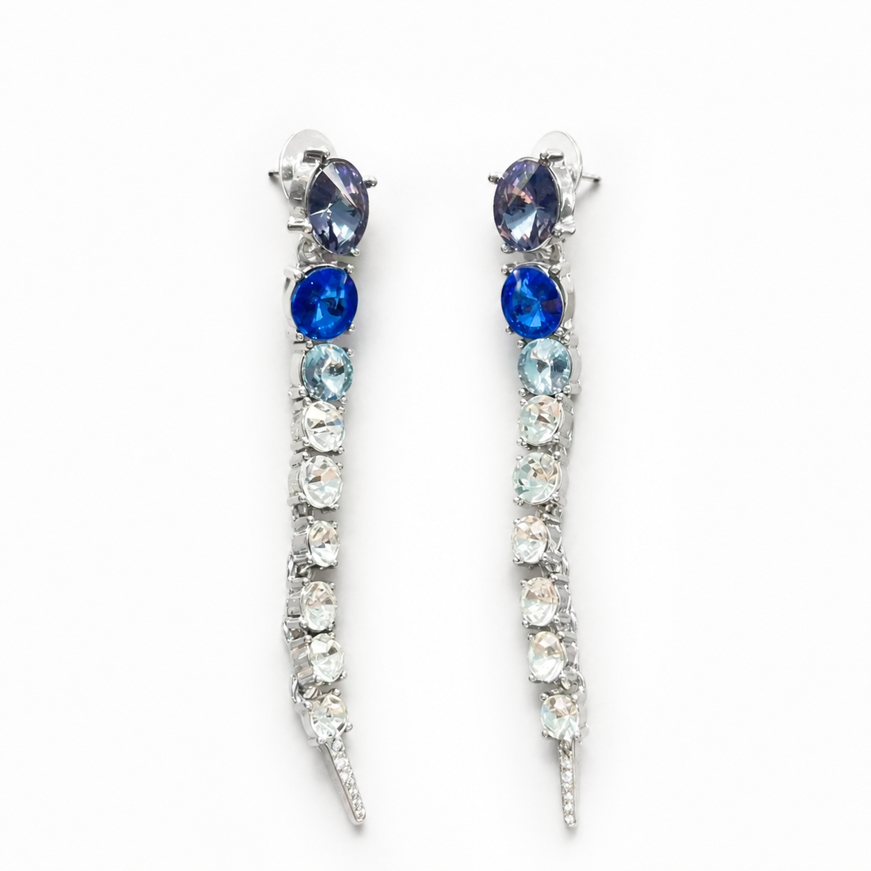 Silver-tone long linear stud earrings with blue and clear faceted crystal-style accents