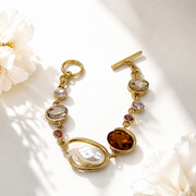 Baroque-inspired orange rhinestone and pearl-style bracelet
