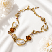 Baroque-inspired orange rhinestone and pearl-style necklace