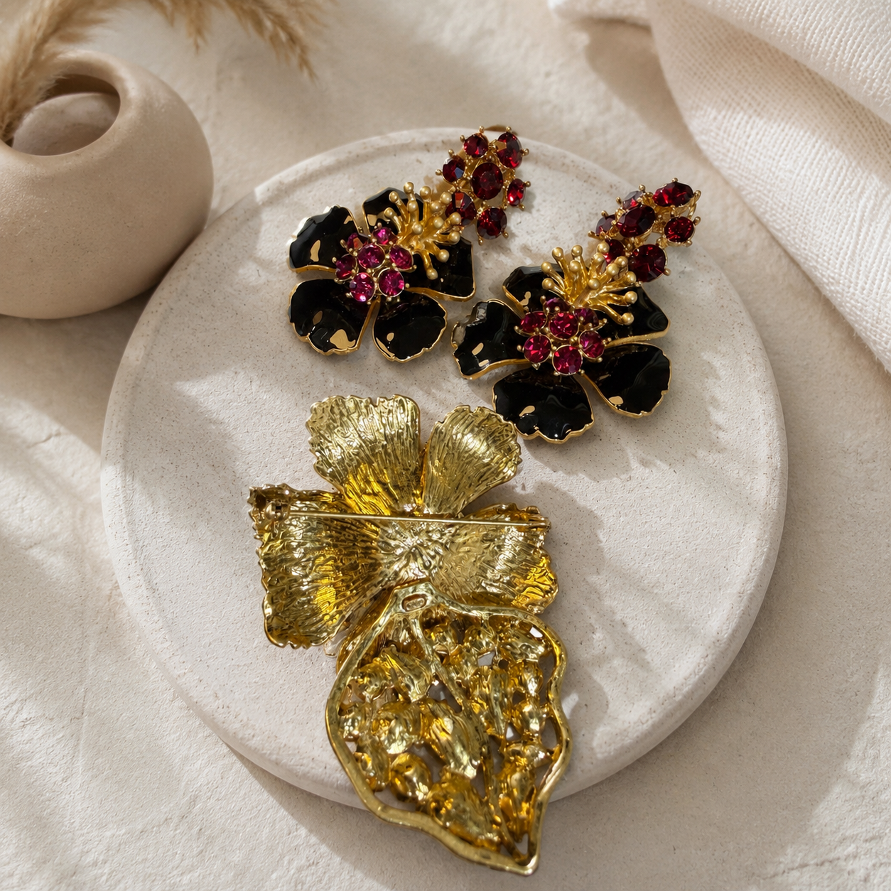 Black enamel-style ruby-red crystal-style brooch set back view with pin closure