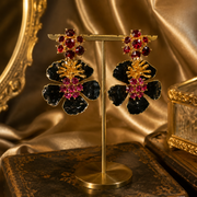 Black enamel-style ruby-red crystal-style large stud earrings front view
