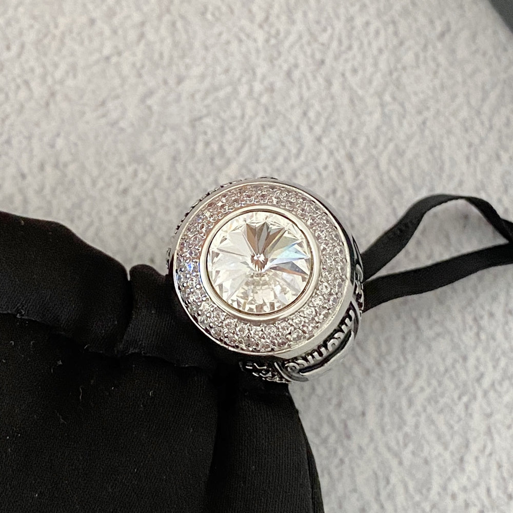 Silver-tone cat motif ring with clear faceted center accent and crystal-style halo