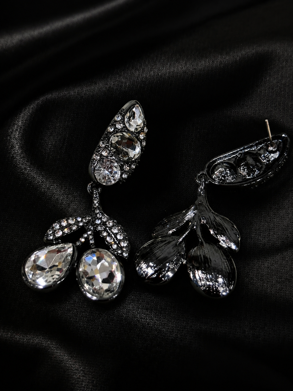 Clear crystal-style drop earrings with faceted accents, front and back view