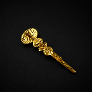 Colorful glass-style wand brooch showing the pin-back fastening