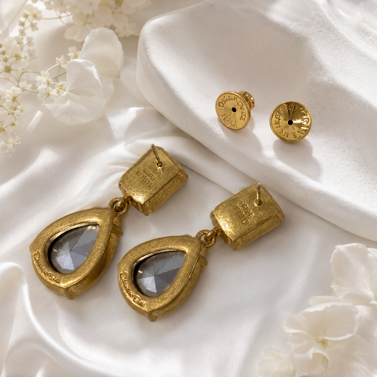 Back view of crystal-style teardrop drop stud earrings showing post backs