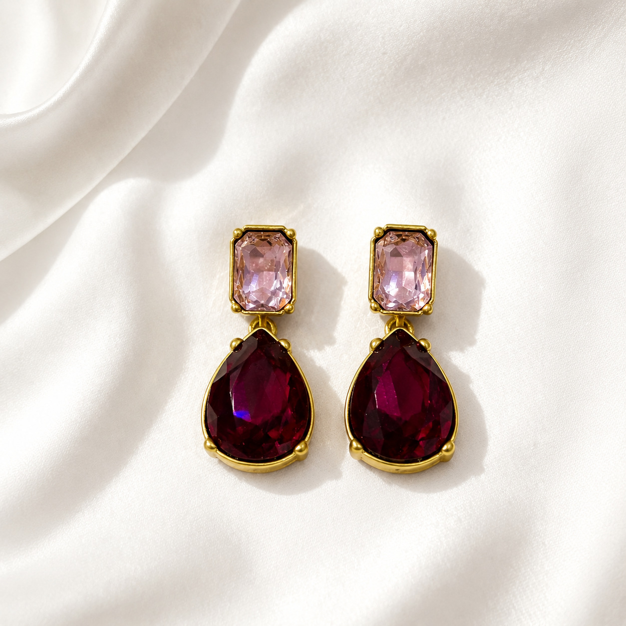 Fuchsia crystal-style teardrop drop stud earrings with gold-tone settings