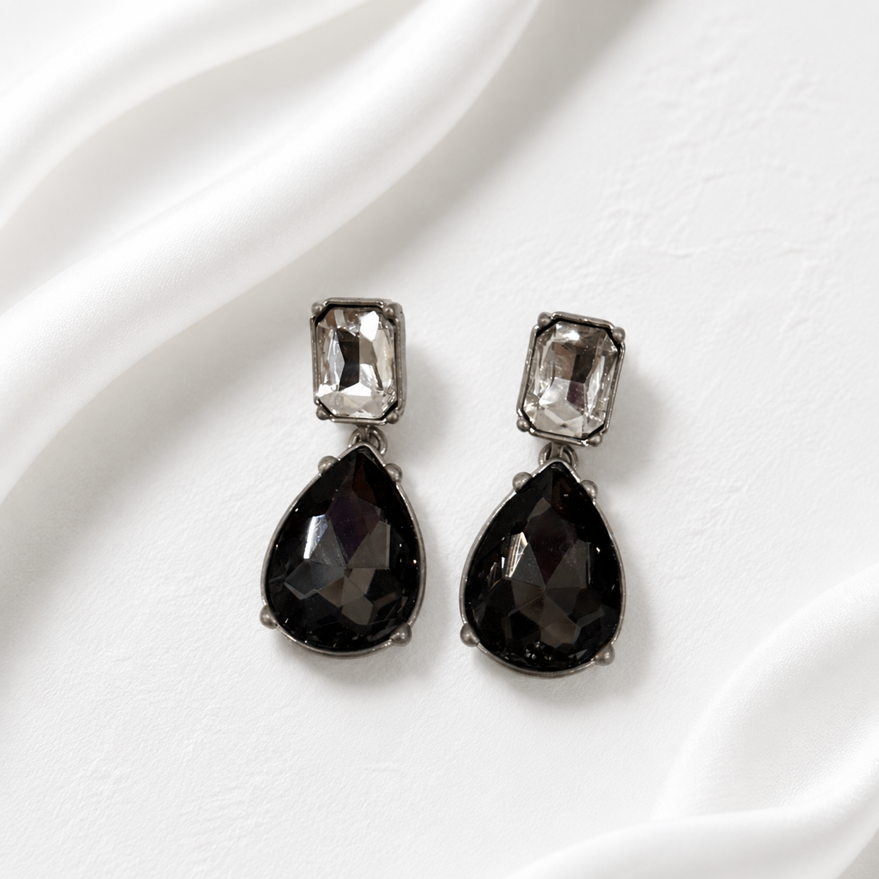 Gray crystal-style teardrop drop stud earrings with silver-tone settings