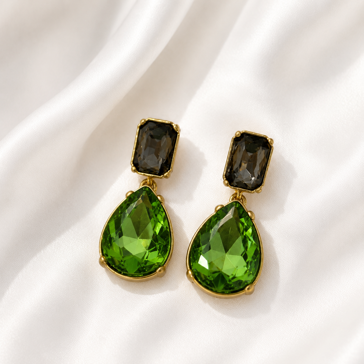 Light green crystal-style teardrop drop stud earrings with gold-tone settings