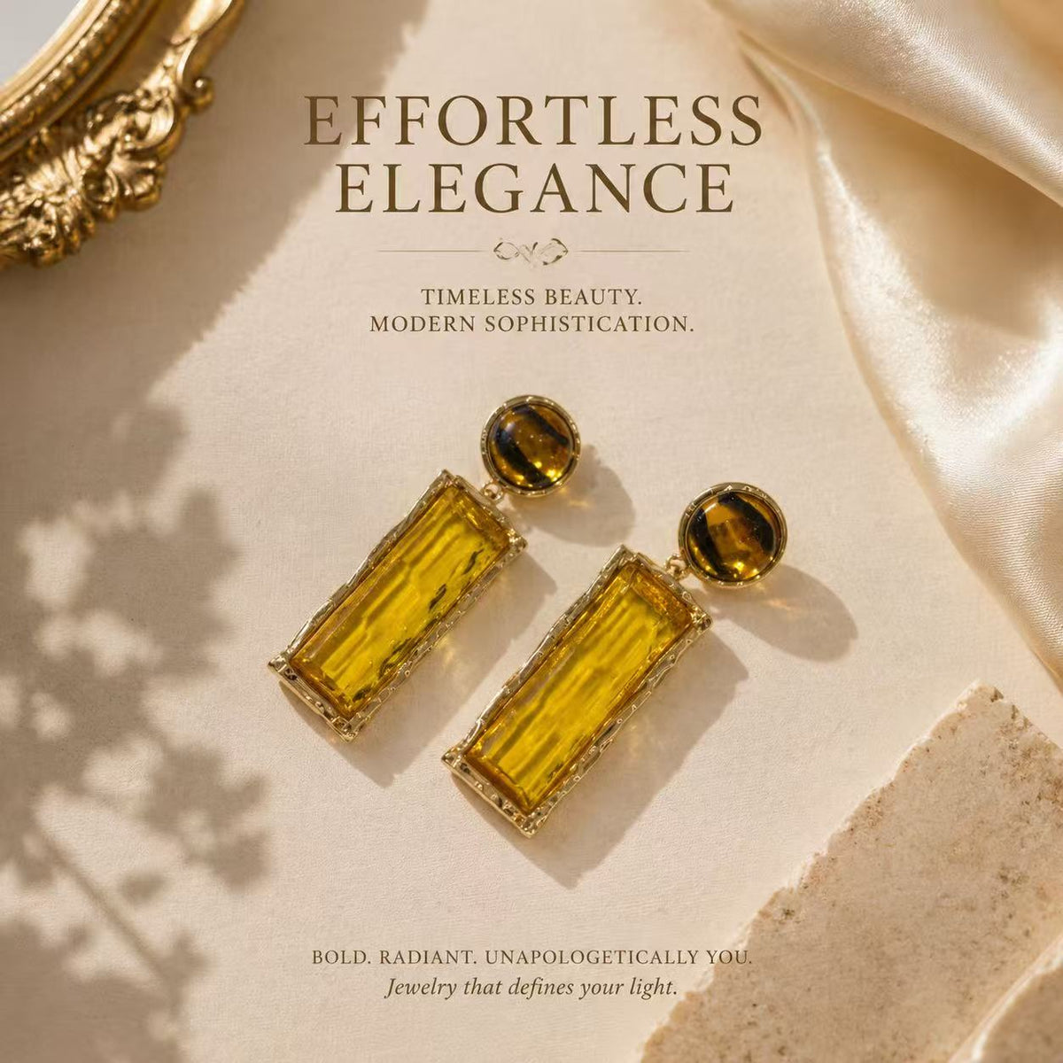 Gold-tone amber glass-style rectangular drop stud earrings flat lay