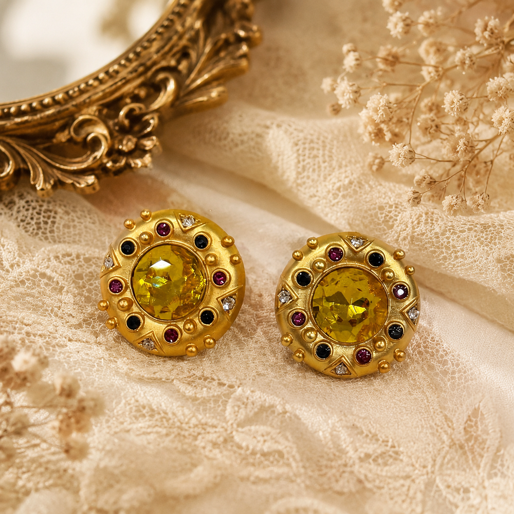Gold-tone amber-yellow crystal-style statement stud earrings front view