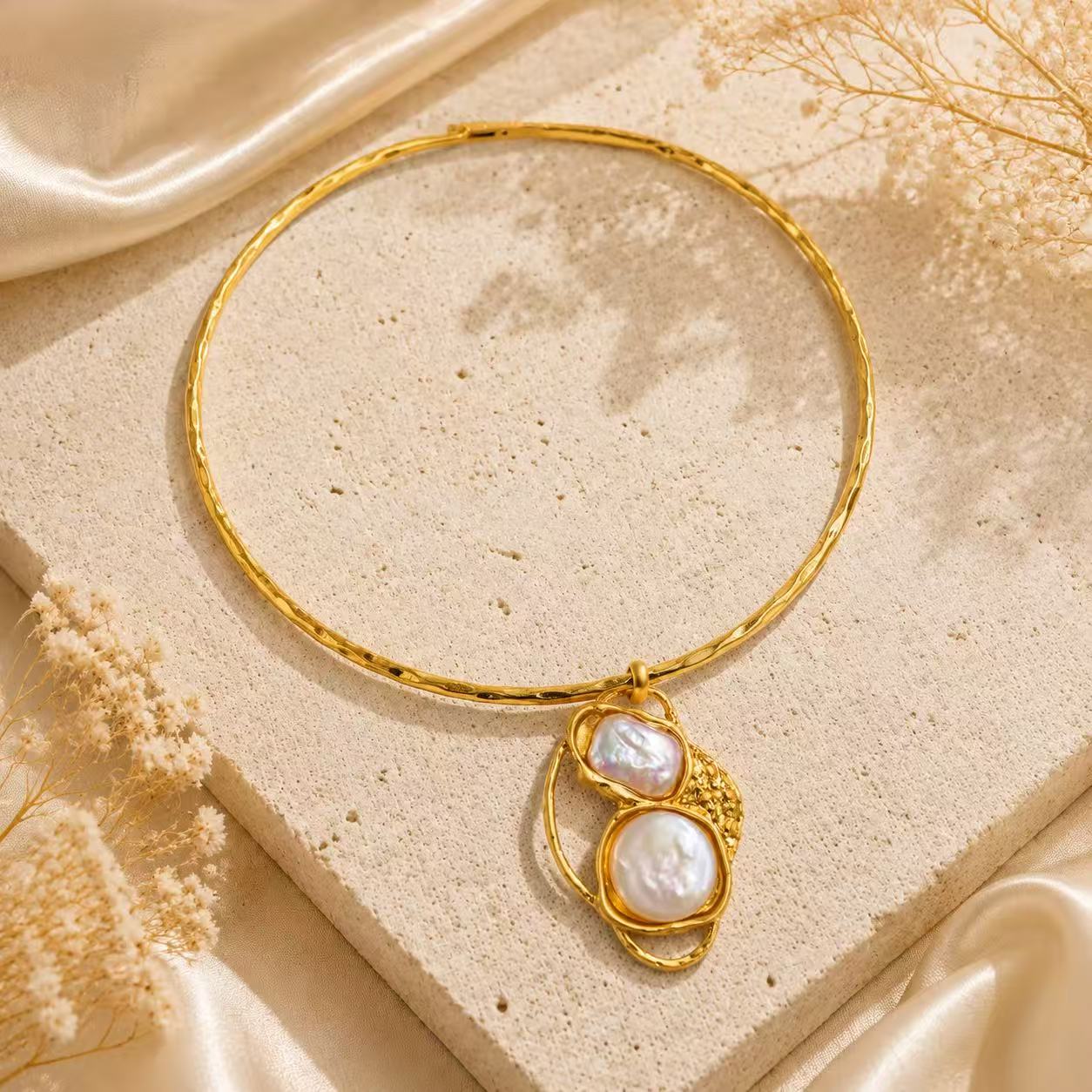 Gold-tone pearl-style pendant choker necklace angled view