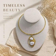 Gold-tone baroque pearl-style pendant choker necklace displayed on a bust