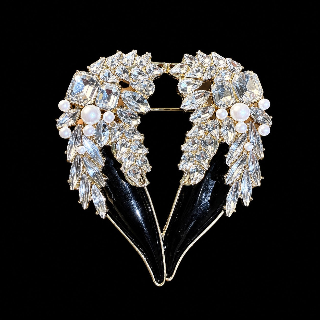 Gold-tone black crystal-style winged heart statement brooch front view