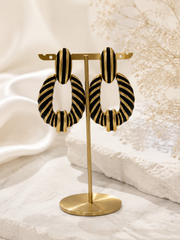 Gold-tone black enamel-style zebra stripe statement earrings front view