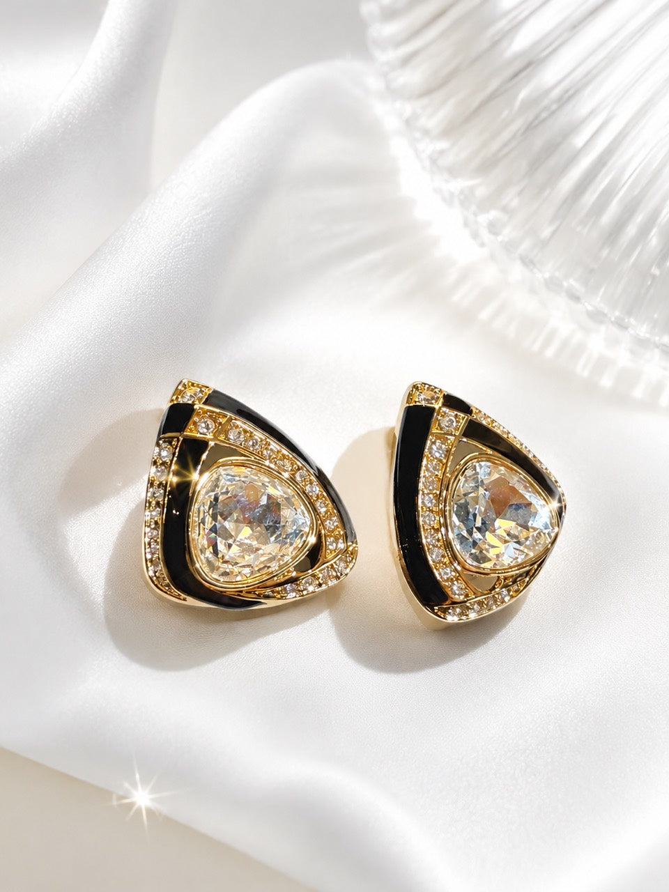 Gold-tone black glass triangle clip-on earrings front view