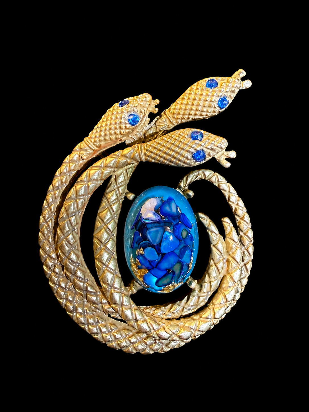 Gold-tone blue cabochon-style serpent statement brooch front view
