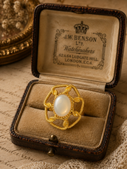 Gold-tone cat eye-style large adjustable open ring front view