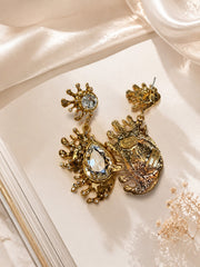 Gold-tone clear rhinestone-style teardrop stud earrings back detail