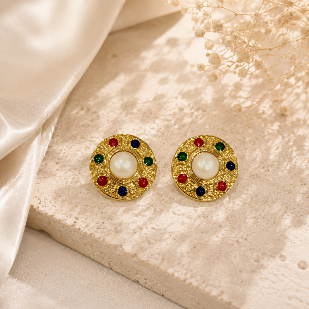 Pair of gold-tone round stud earrings with pearl-style centers and red, green, and navy enamel-style accents