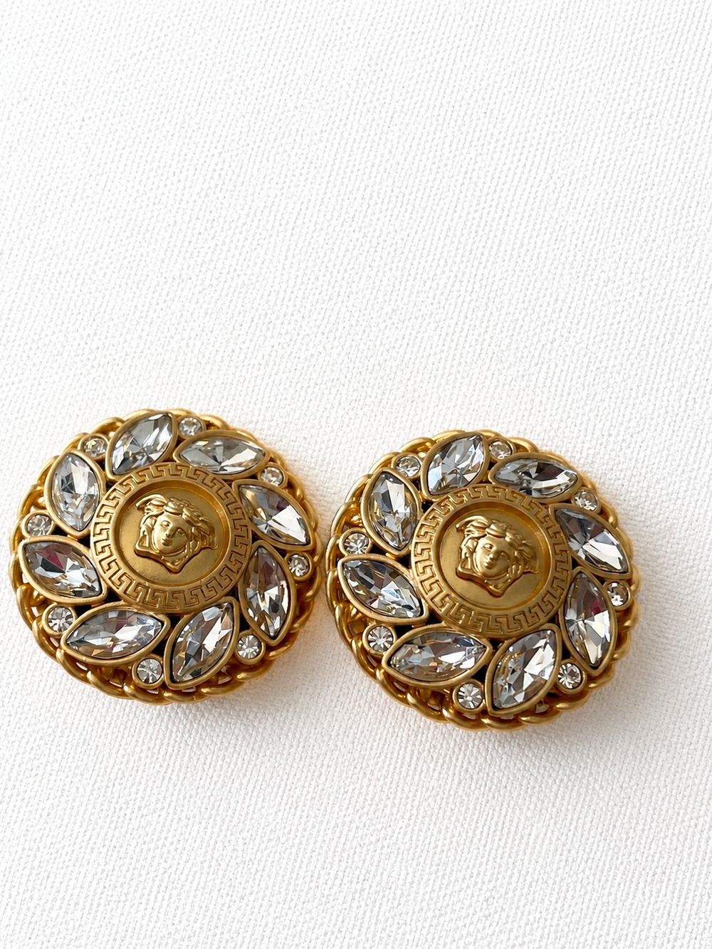 Gold-tone crystal medallion clip-on earrings front view