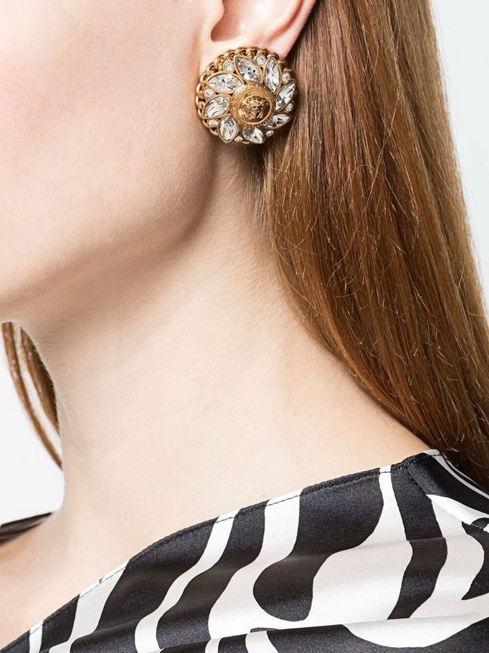 Gold-tone crystal medallion clip-on earrings worn view