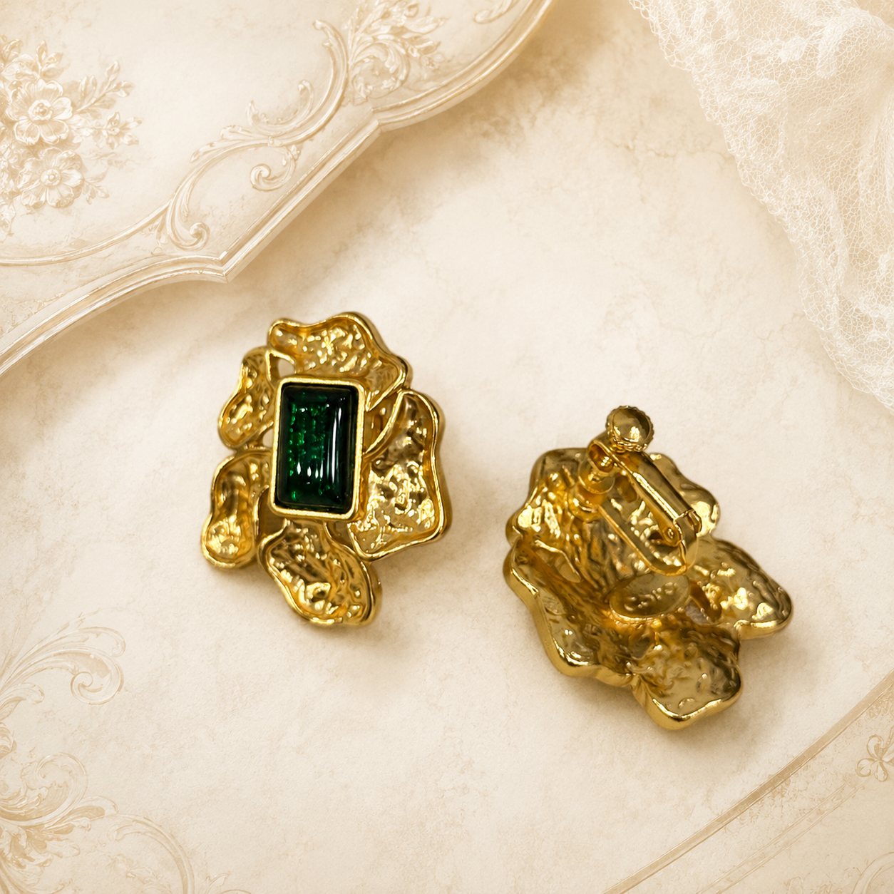 Front and back view of green gold-tone crystal-style abstract flower earrings