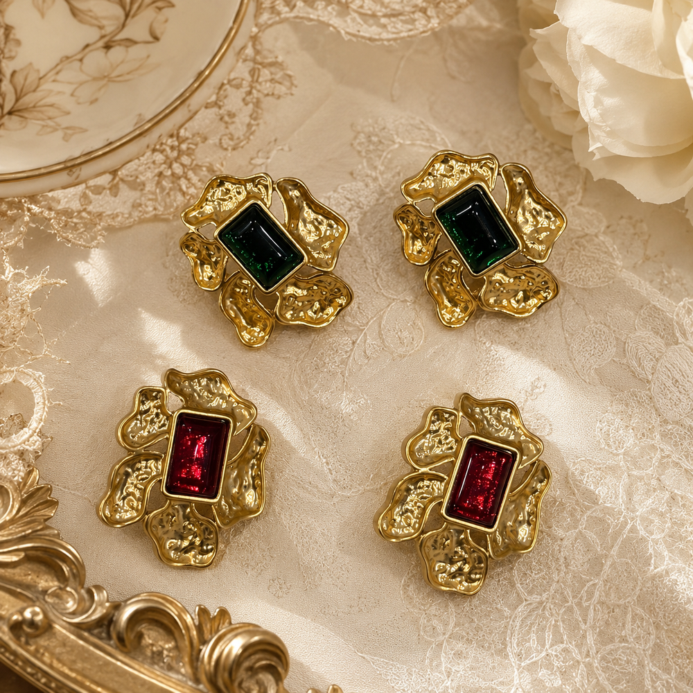 Red and green gold-tone crystal-style abstract flower statement earrings
