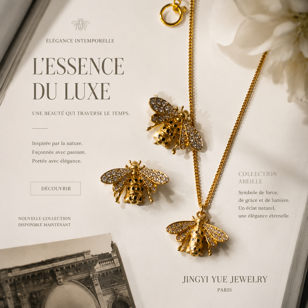 Gold-tone clear crystal accent bee necklace and clip-on earrings set flat lay