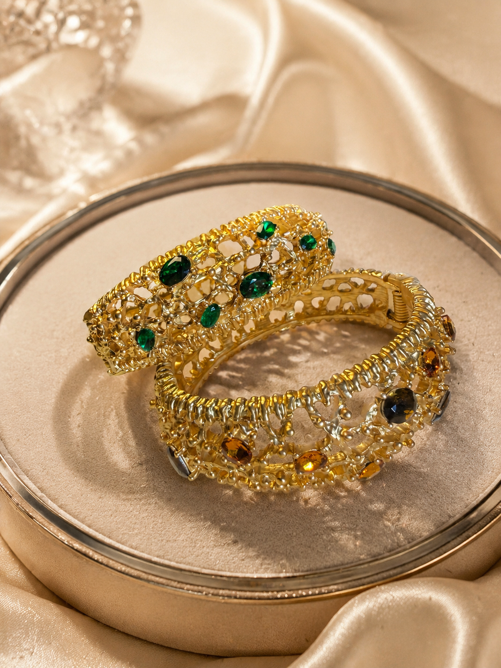 Gold-tone cuff bracelets in green and amber colors
