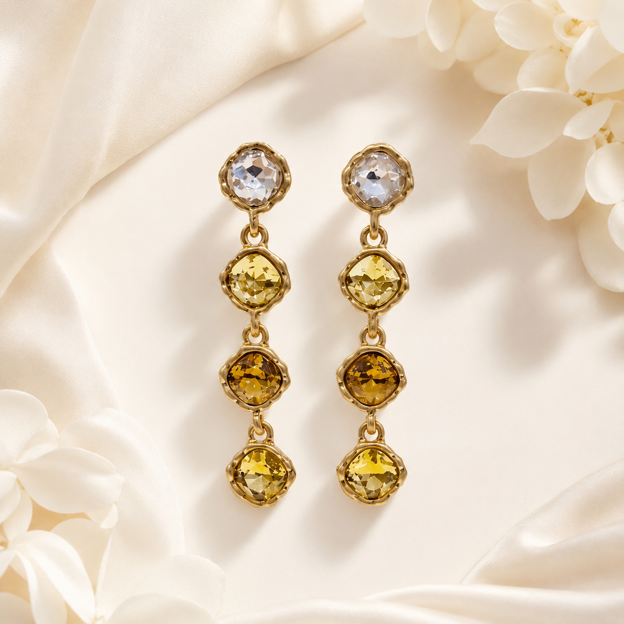 Brown gold-tone crystal-style four-stone drop stud earrings