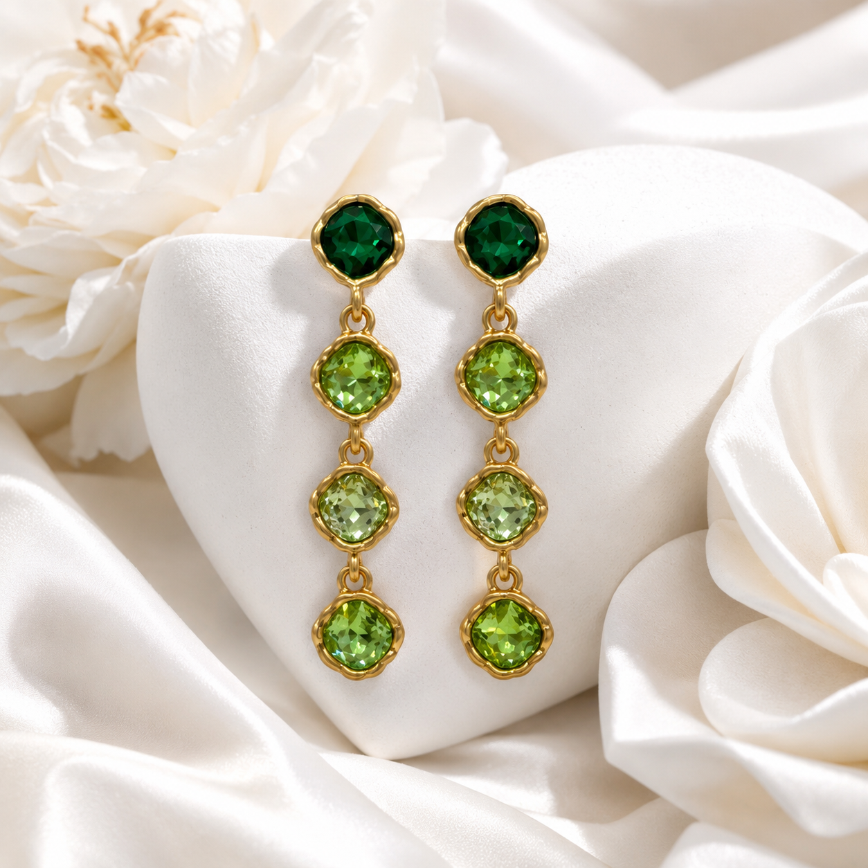 Green gold-tone crystal-style four-stone drop stud earrings