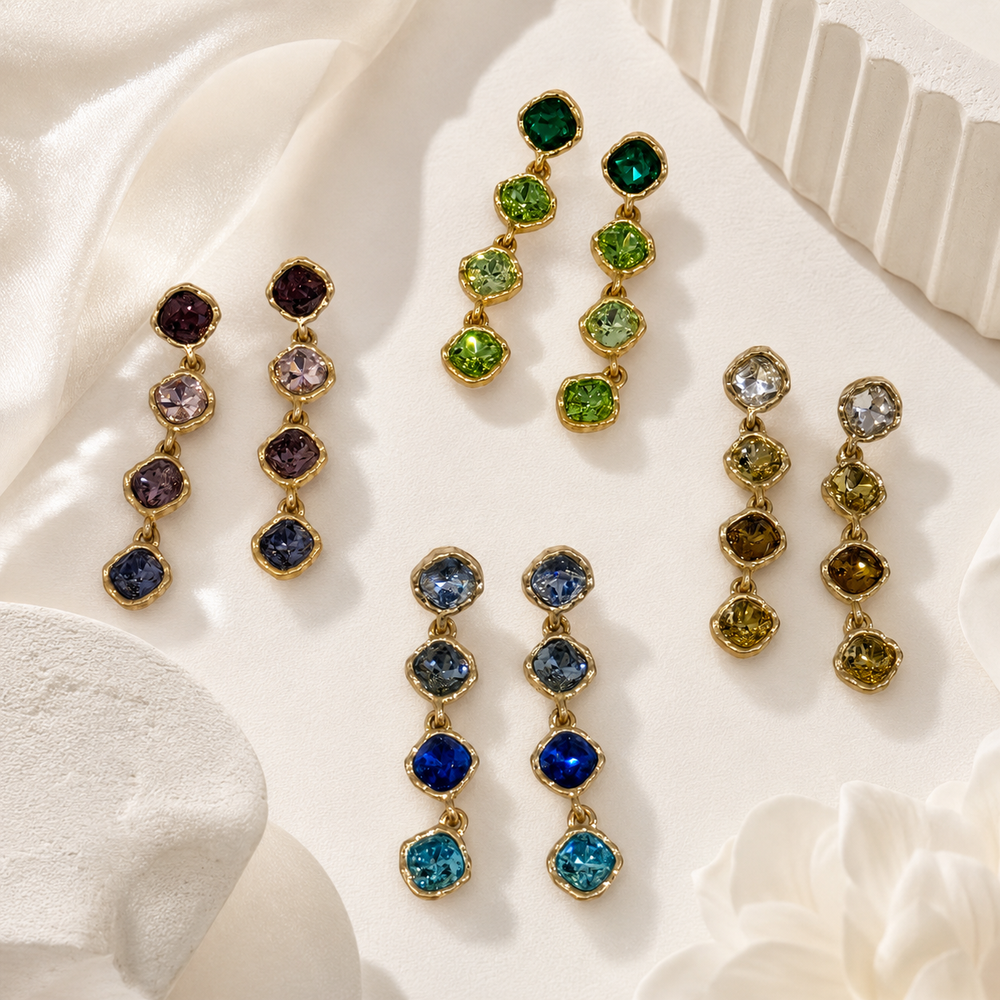 Four colorways of gold-tone crystal-style four-stone drop stud earrings