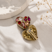 Gold-tone pink crystal-style heart clip-on earrings back clip detail