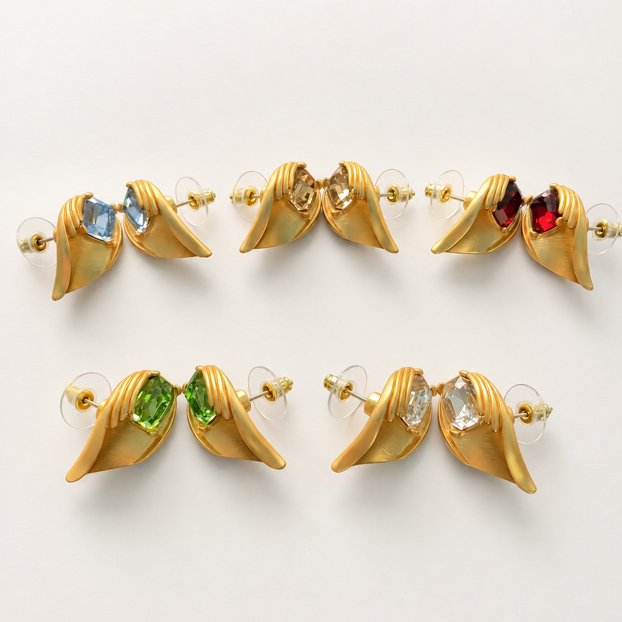 Gold-tone crystal-style leaf stud earrings in light blue champagne wine red light green and clear colors