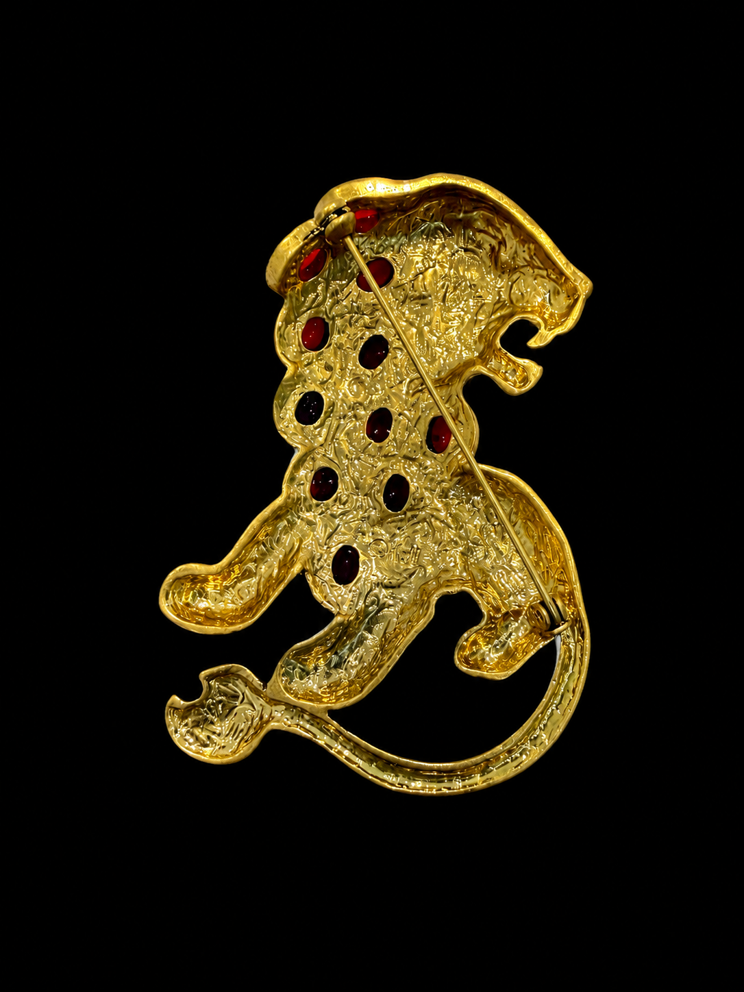 Gold-tone red crystal-style lion statement brooch back pin detail